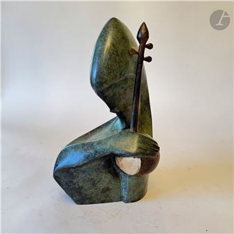 A sculptural figure in a greenish hue holding a stringed instrument.