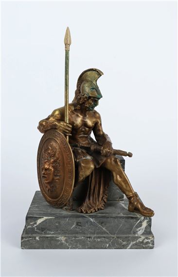 A bronze statue of a man holding a spear and shield.