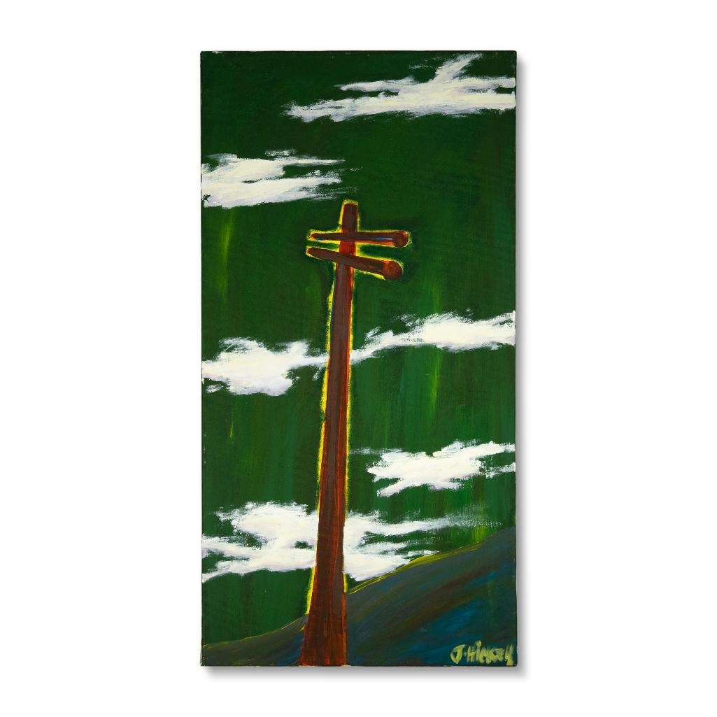 A tall wooden pole stands against a vibrant green sky with white clouds.