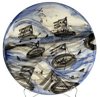 A circular ceramic plate featuring a chaotic seascape with multiple small boats, parachutes, and flags against a swirling blue and black background.
