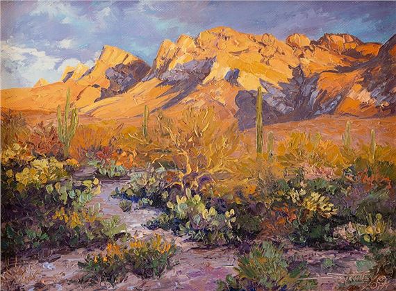 A vibrant desert landscape painting featuring golden mountains, cacti, and a dry wash under a dramatic sky.