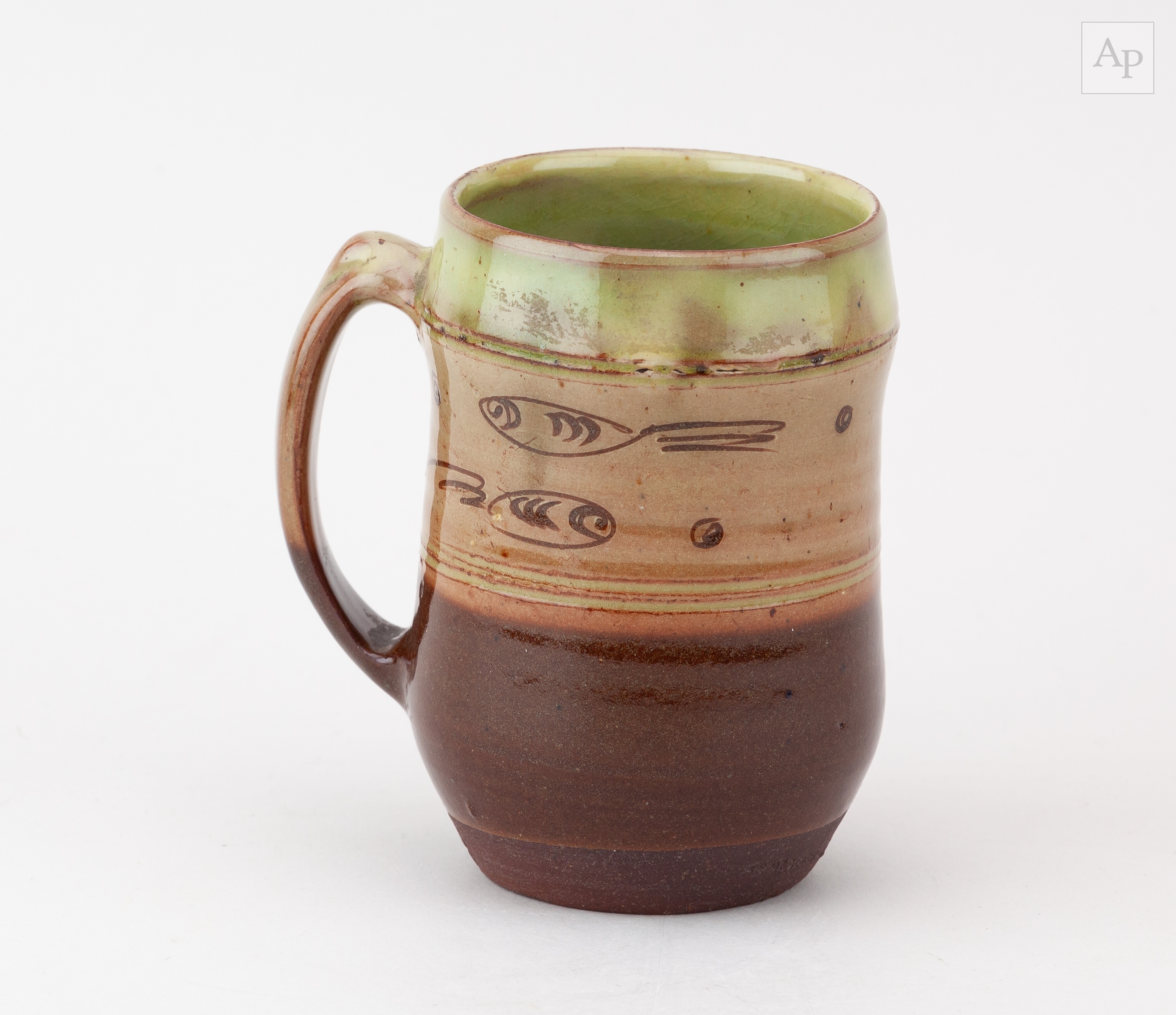 Ray Finch | Winchcombe Pottery; a slipware mug decorated with fish ...