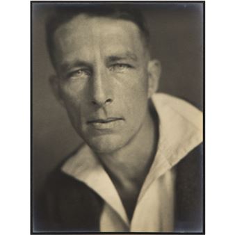 A black and white photo of a man in a sailor's uniform.