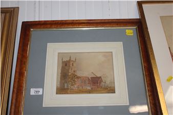 A framed watercolor painting of a stone church and red-roofed building in a rural setting.
