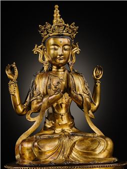 A LARGE AND FINELY INLAID SINO-TIBETAN GILT-BRONZE FIGURE OF THE FOUR-ARMED GUANYIN, SHADAKSHARI LOKESHVARA, MING DYNASTY, 16TH TO EARLY 17TH CENTURY