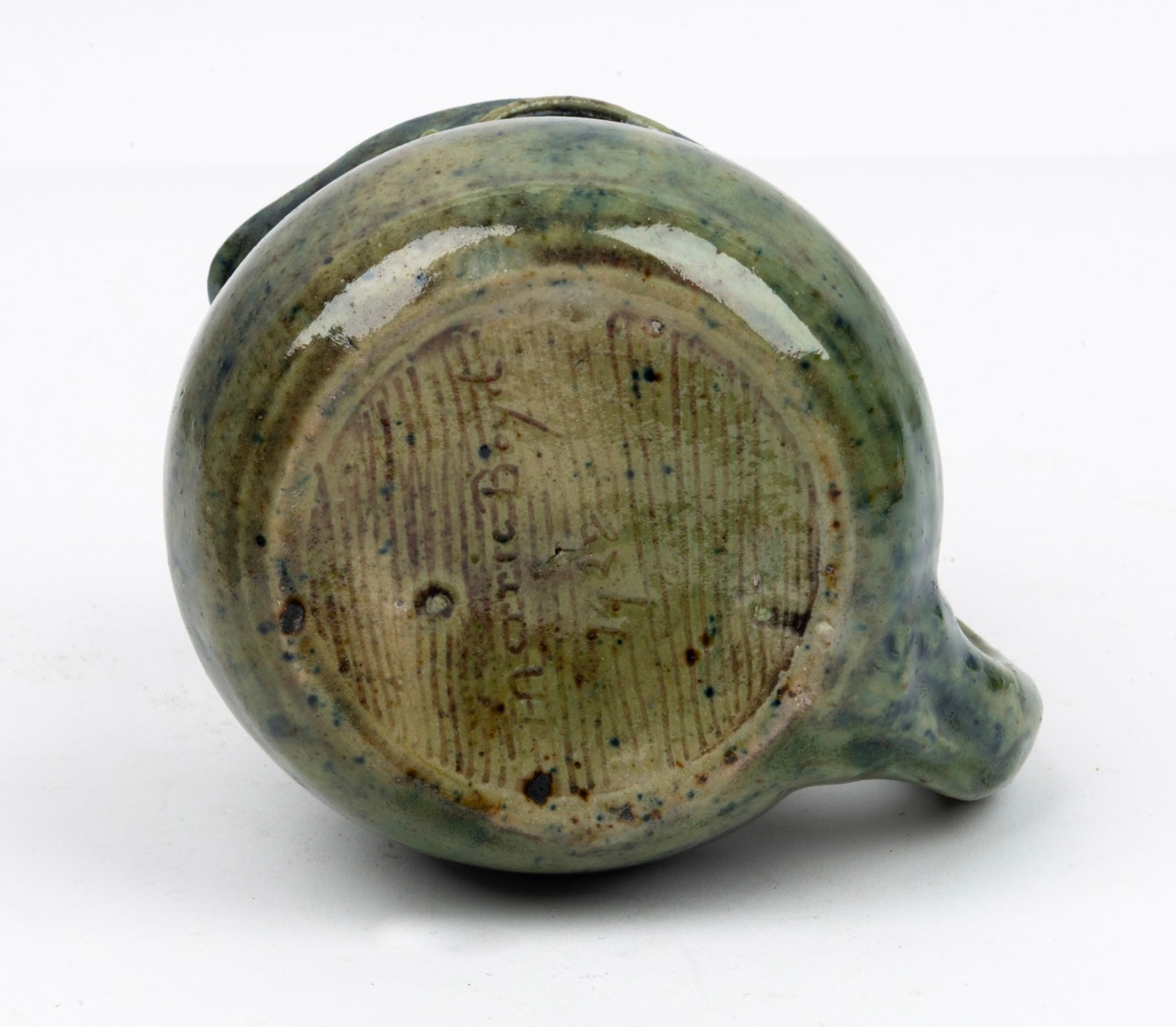 William Merric Boyd | green glazed pottery jug with applied grape ...