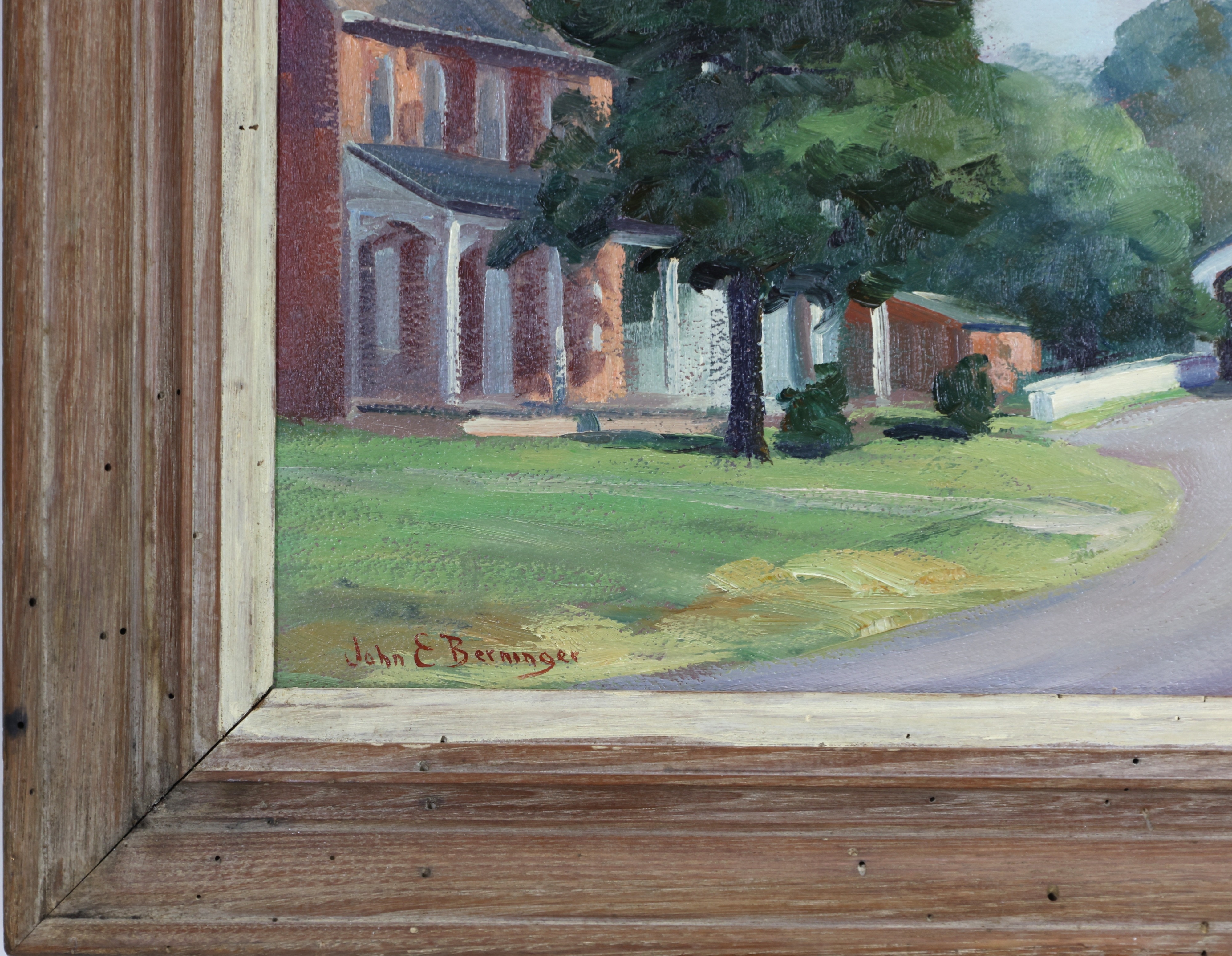 A rural landscape painting featuring a covered bridge, a red brick house, and a large tree under a cloudy sky.