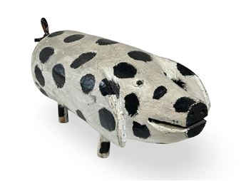 A black and white spotted piggy bank on a white background.