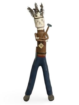 A wooden sculpture of a man holding a hammer and a hat.
