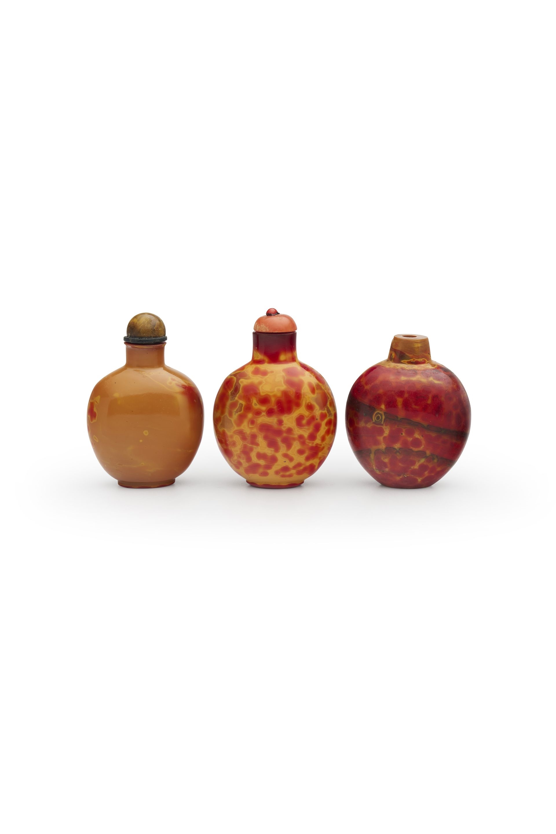 Chinese School | THREE REALGAR GLASS SNUFF BOTTLES | MutualArt