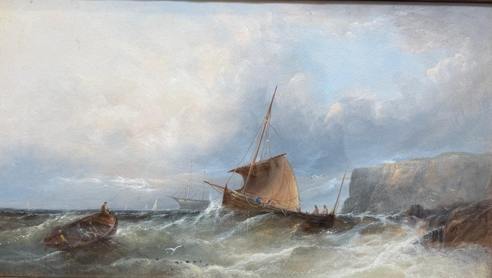 A seascape painting of a ship battling rough waves near rocky cliffs.