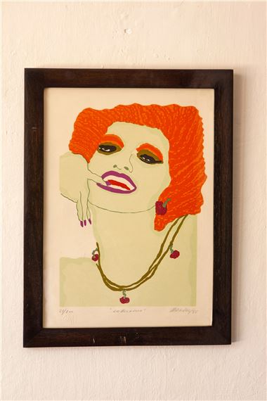 A stylized portrait of a figure with vibrant orange hair and bold makeup, framed in dark wood.