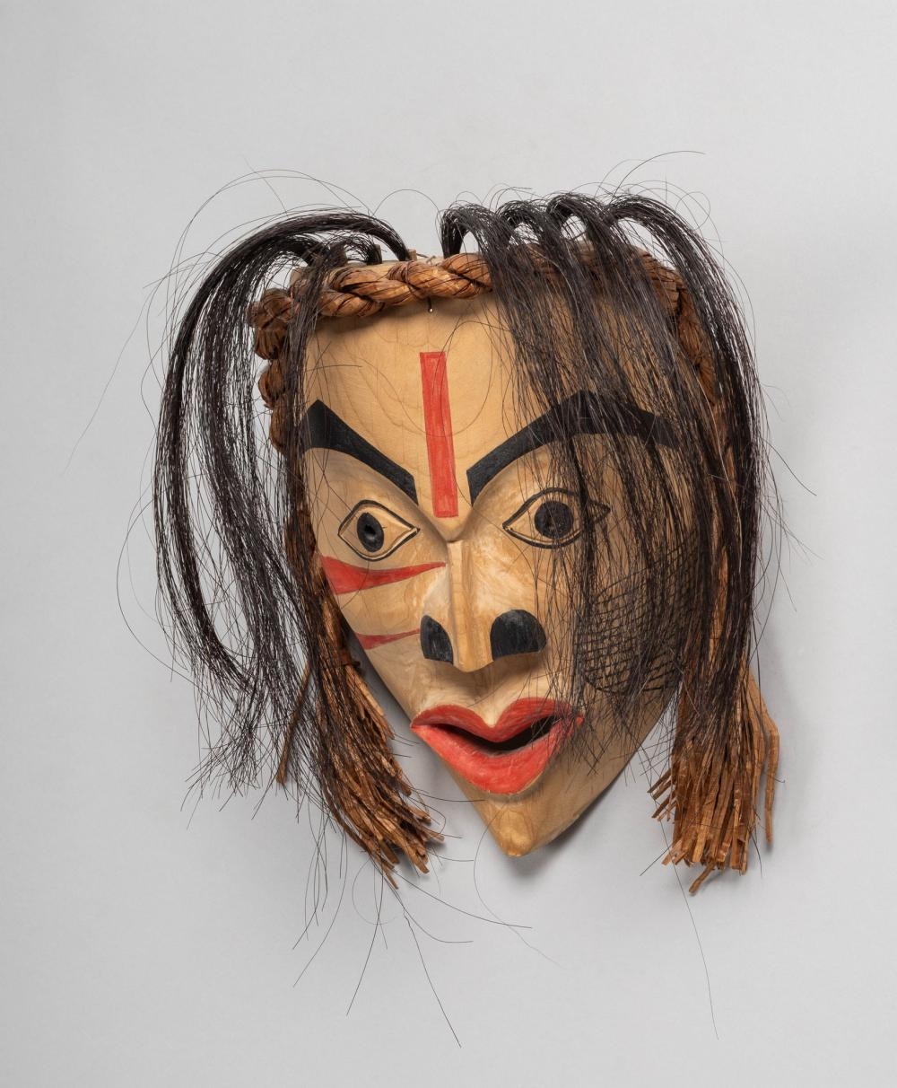 Elma Thomson | a Tsimshian carved and stained wood mask of a female ...