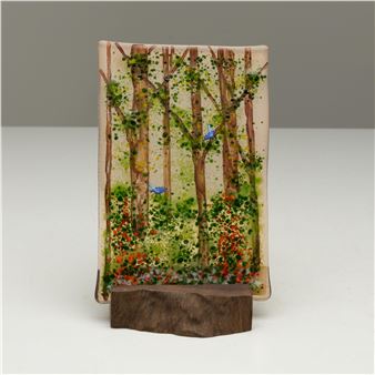 A picture of a painting of a forest with trees and flowers.