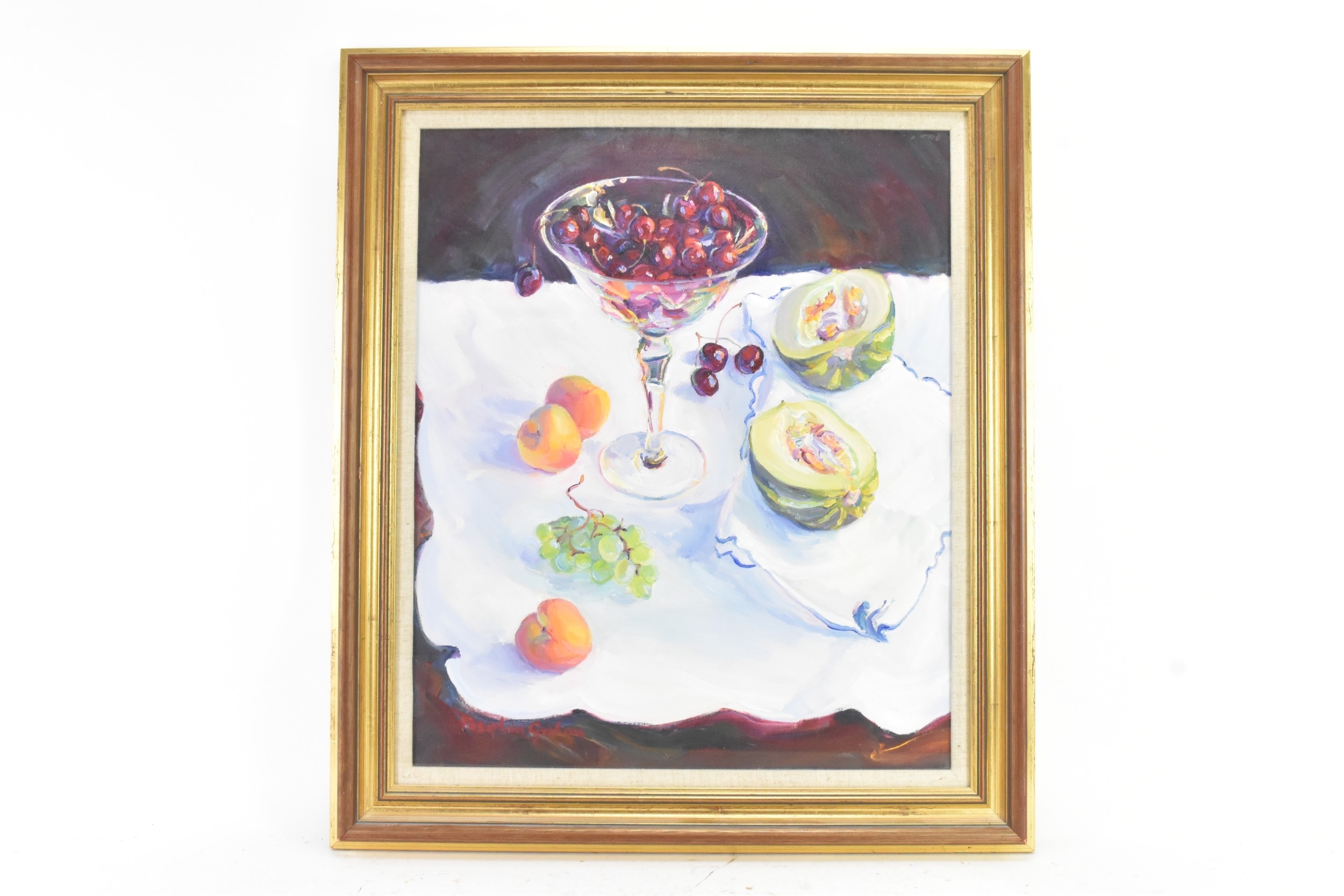 A still life painting featuring a glass bowl of red fruit and halved melons on a white cloth.