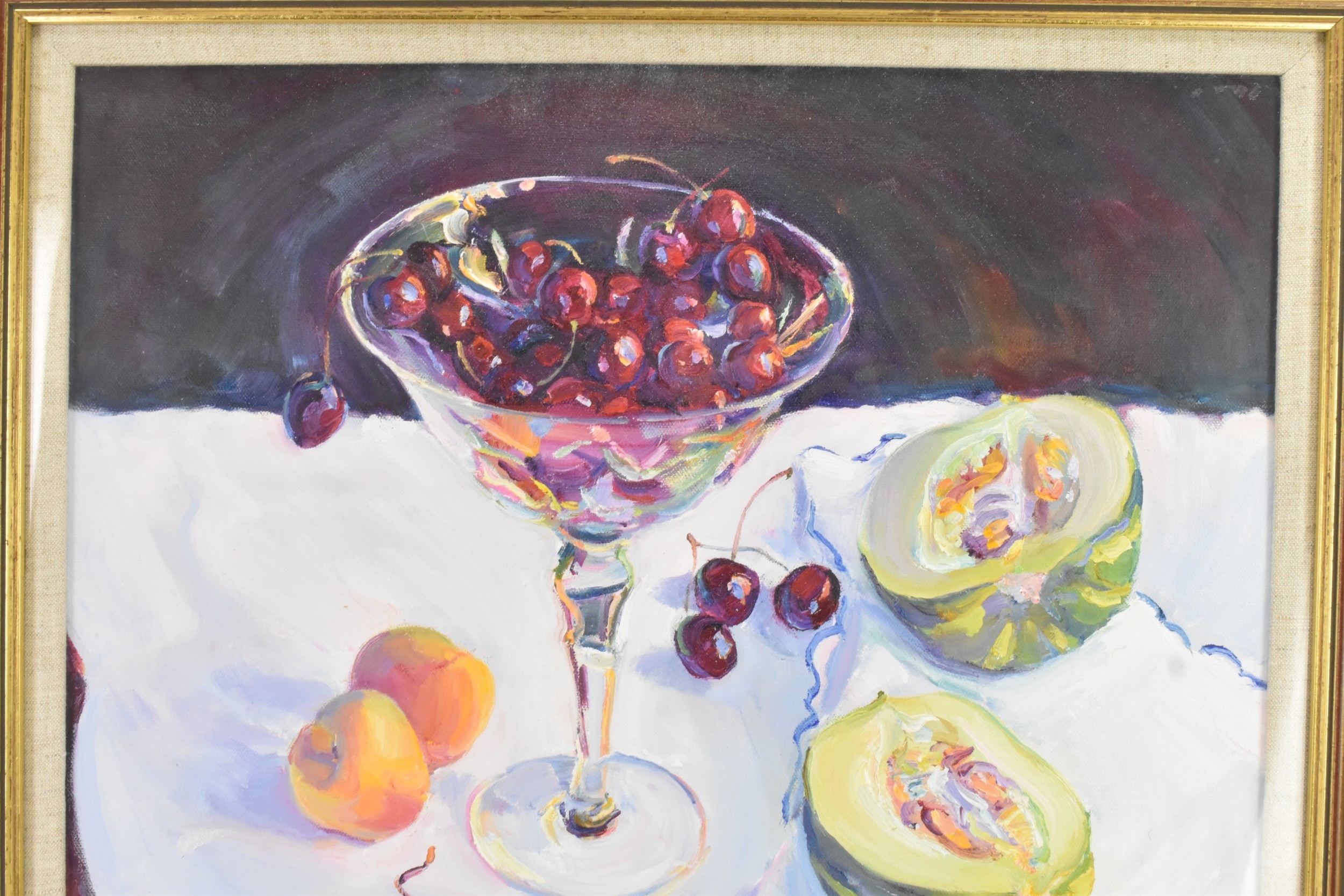 A still life painting featuring a glass bowl of red fruit and halved melons on a white cloth.