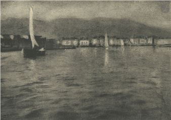 A monochromatic maritime scene featuring a sailboat on rippling water with a distant shoreline.