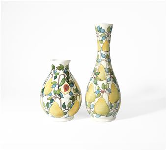 A pair of ceramic vases decorated with a pear motif.