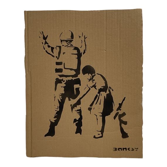 A black stencil print on brown corrugated cardboard depicting a soldier and a child.