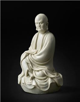 A blanc de Chine seated figure of Bodhidharma