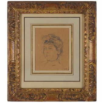 A framed charcoal sketch of a person's head and shoulders.