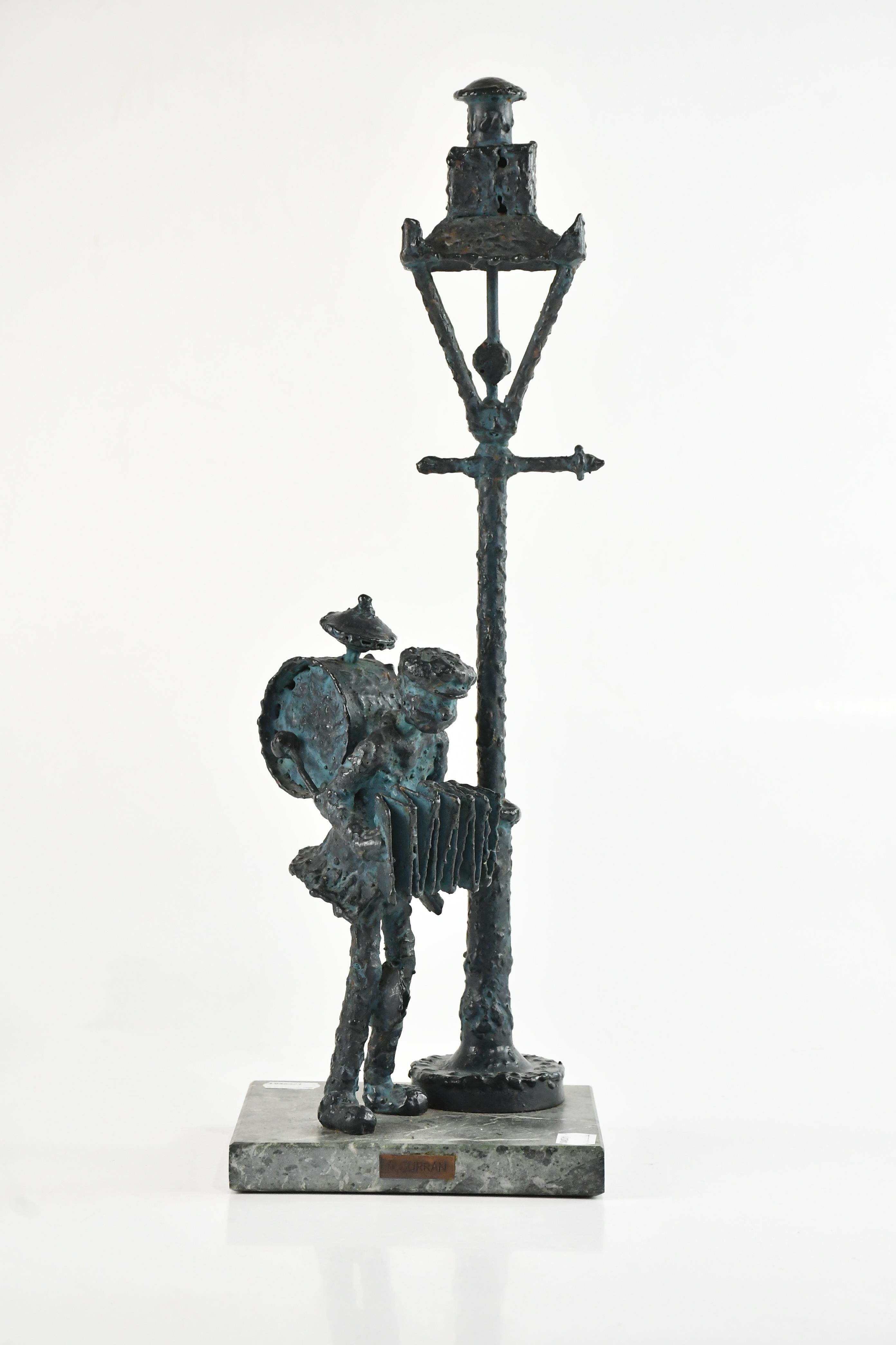 Allen Curran | bronze figure, one man band under street lamp | MutualArt