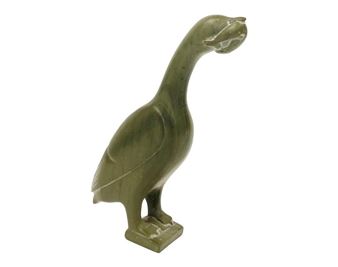 A sculpted bird figure in matte green with a stylized, elongated neck and beak.