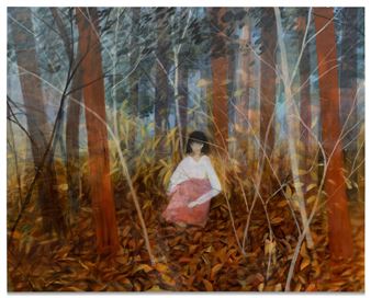 A solitary figure sits amidst a forest of tall, slender trees under an autumnal canopy.