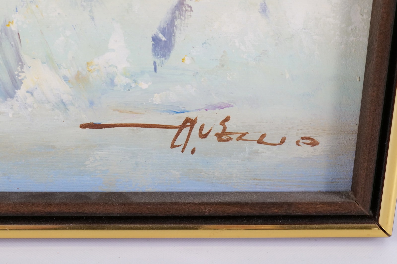 A framed watercolor painting of three galloping horses with vibrant, abstracted colors.