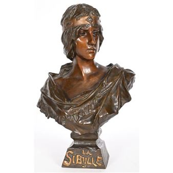 A bronze bust of a draped figure with an ornate crown, resting on a square base.