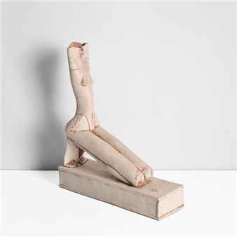 A sculptural figure in a reclining pose, rendered in matte off-white clay against a stark white background.