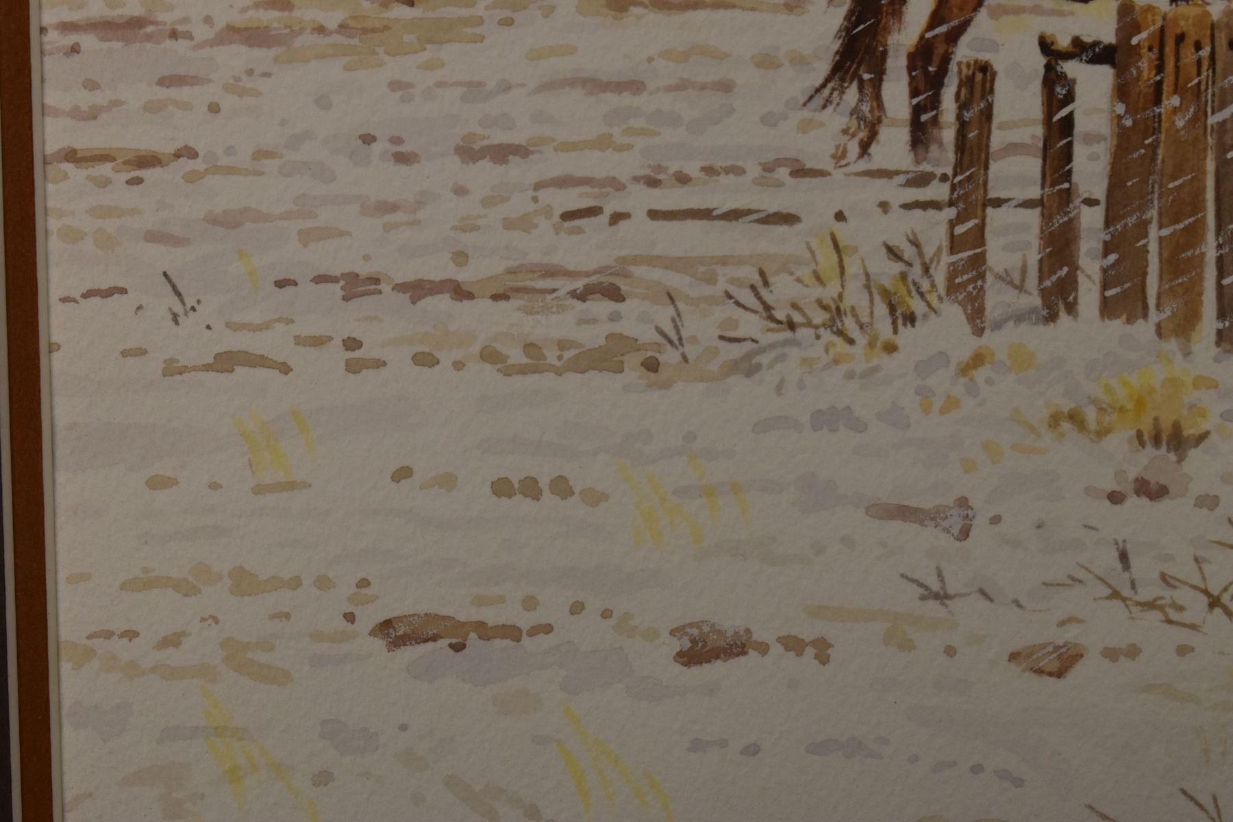 A wintry rural scene featuring a rustic building, wooden fences, and horses in the snow.