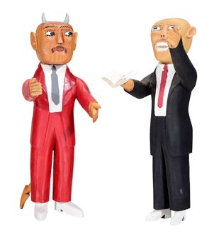 A wooden sculpture featuring two figures in suits, one with devil horns and the other holding a piece of paper.