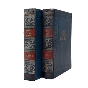A pair of vintage leather-bound books standing side by side, showcasing ornate gold embossing and red title bands.