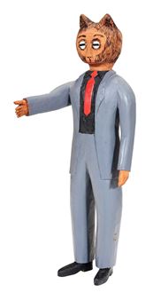 A stylized wooden figure of a suited man with an animal head.