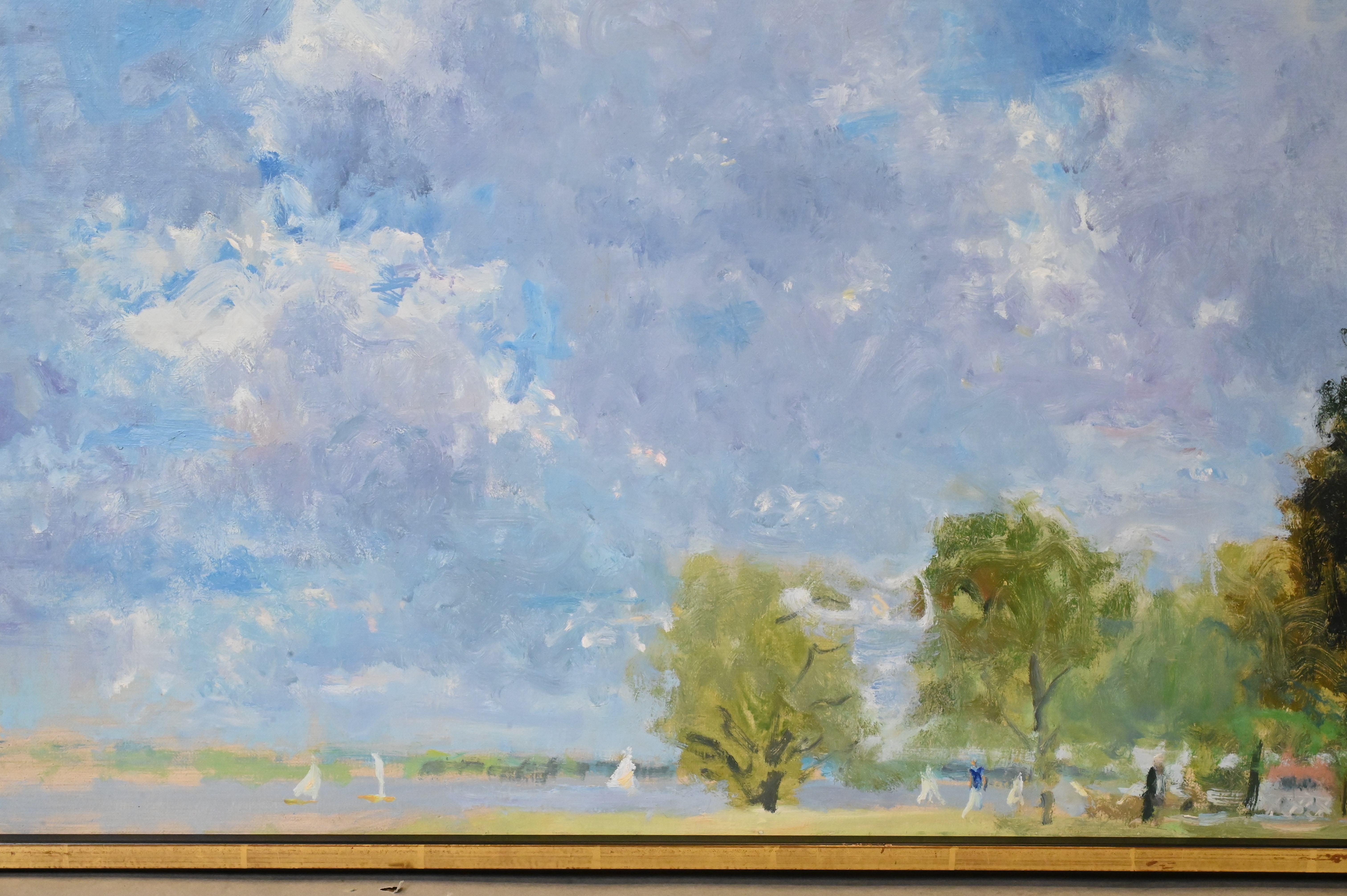 A serene landscape painting featuring a vast blue sky, distant trees, and tiny figures on a grassy shore.
