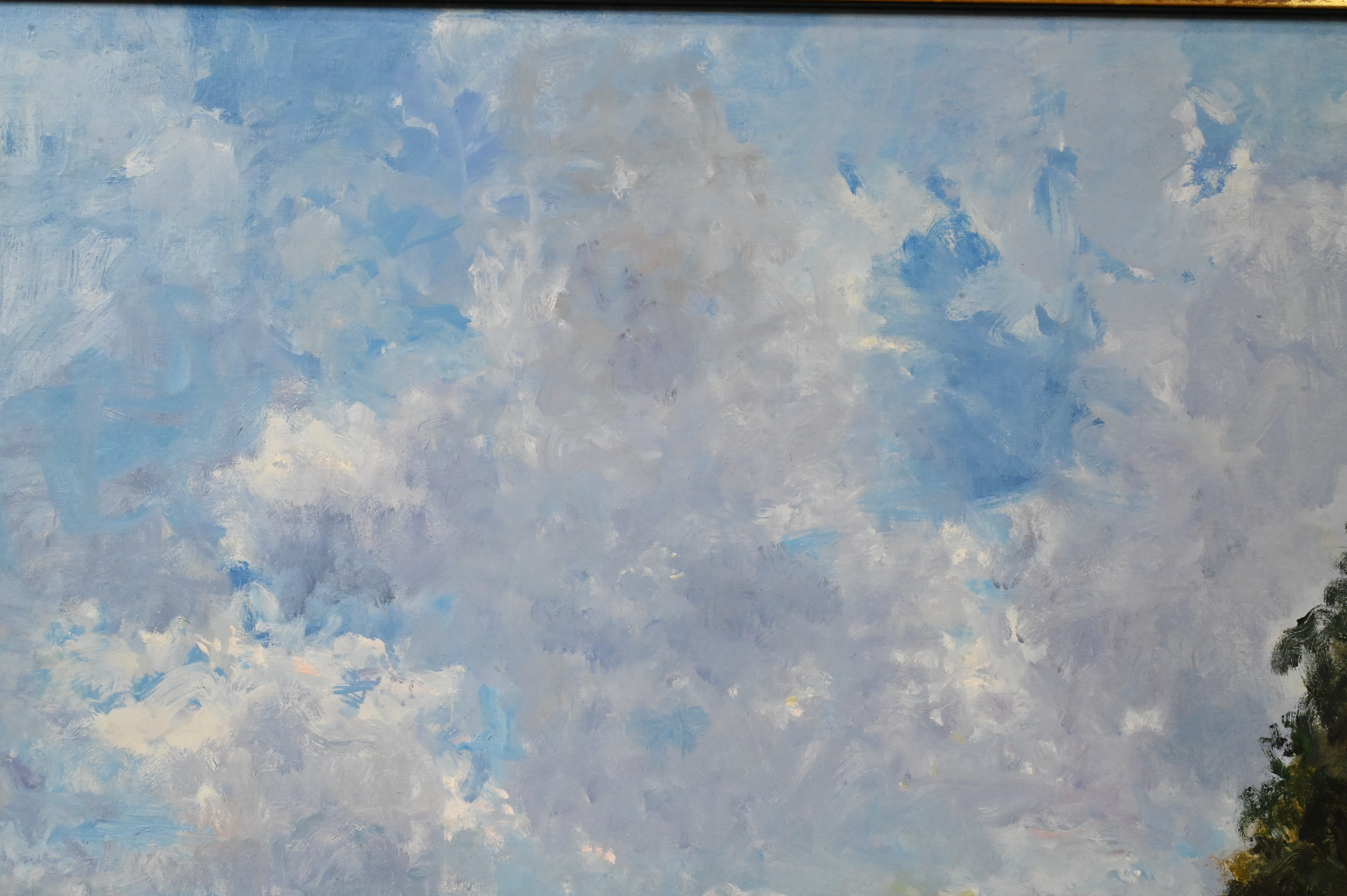 A serene landscape painting featuring a vast blue sky, distant trees, and tiny figures on a grassy shore.