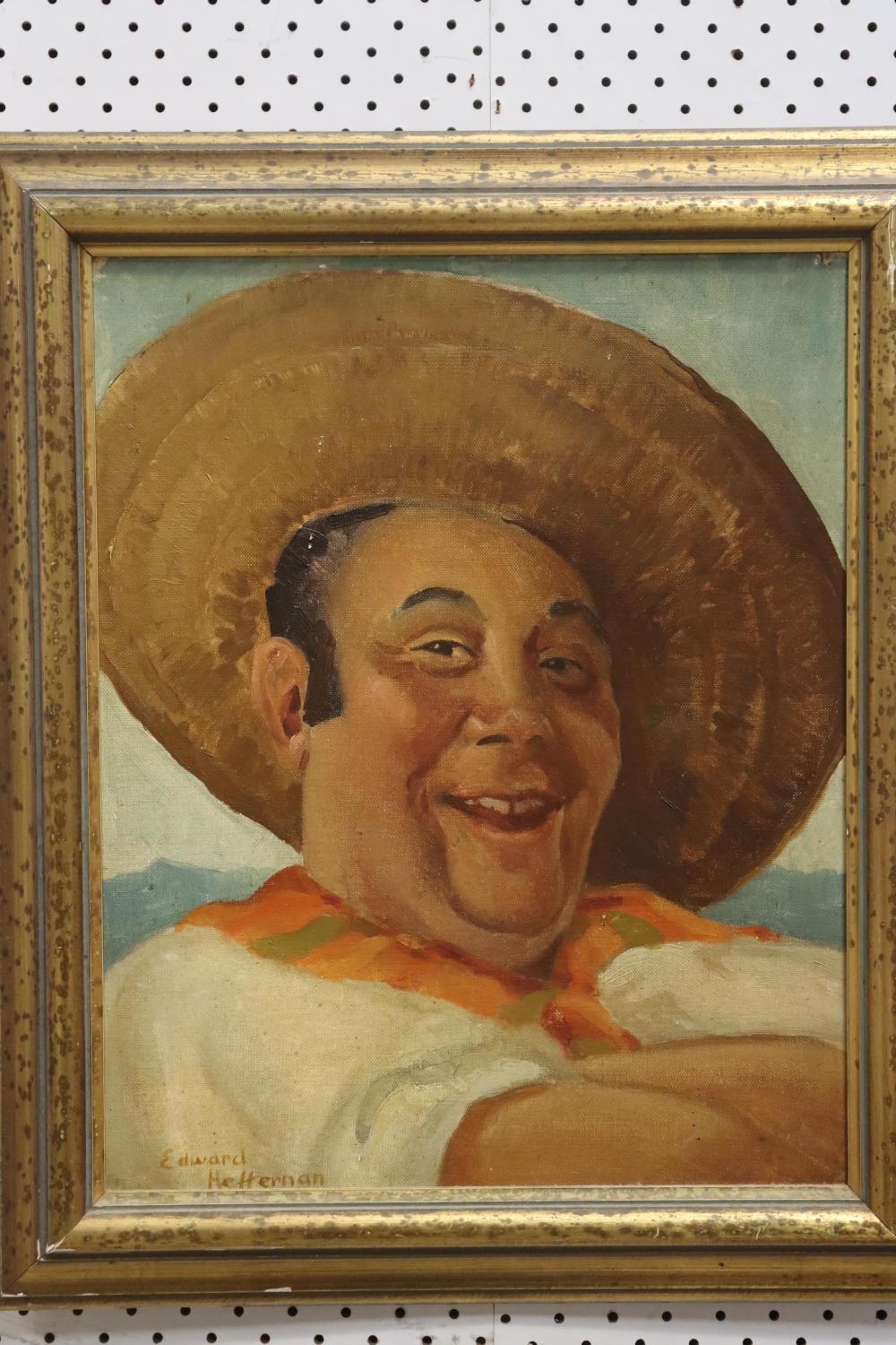 A framed portrait of a smiling man in a sombrero and white shirt against a polka-dotted background.