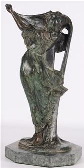 A bronze sculpture of a draped female figure in motion, standing on a stone base.