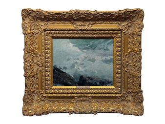 A seascape painting in an ornate gold frame.