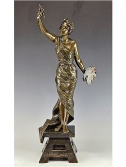 A bronze statue of a female figure holding a palette and brush, standing on a pedestal.