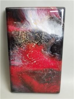 A glossy rectangular slab featuring a dynamic abstract composition of red, black, and white with metallic flecks.