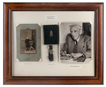 A framed display of three vintage photographs and a small black book.