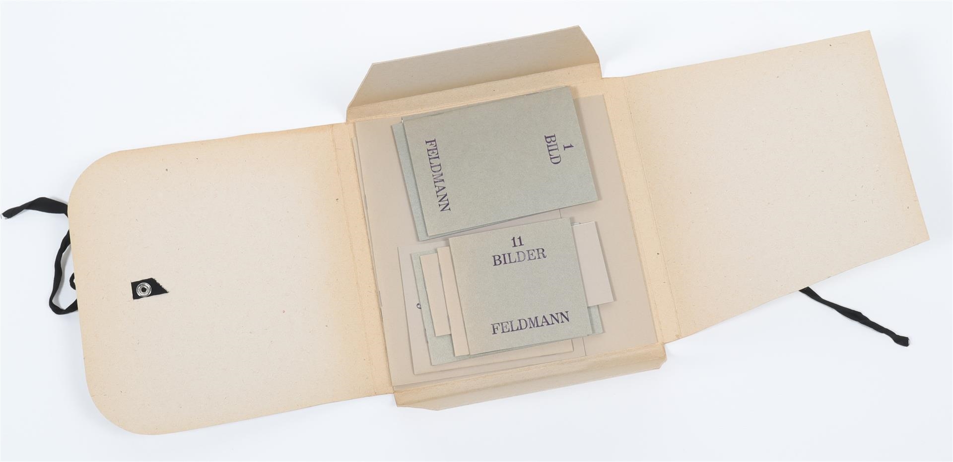 A minimalist arrangement of rectangular cards in varying shades of beige and gray, each printed with numbers and text.