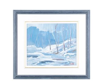A framed winter landscape painting featuring snow-covered ground and bare trees against a blue sky.
