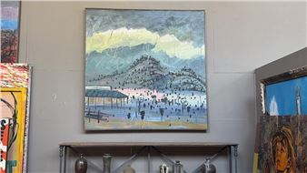 A landscape painting of a coastal town with a mountain and sea, displayed on a wall among other artworks.