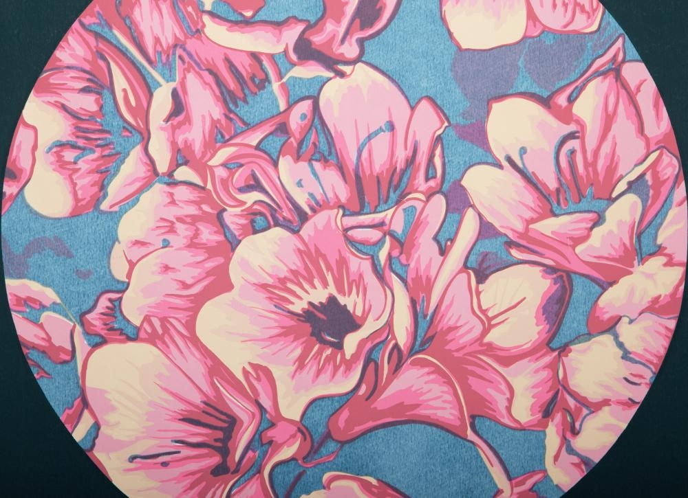 A circular floral print featuring pink blossoms against a teal background.