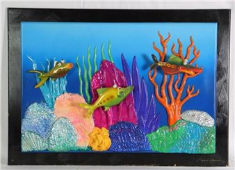 A colorful relief artwork depicting an underwater coral reef scene with stylized fish and vibrant marine life.