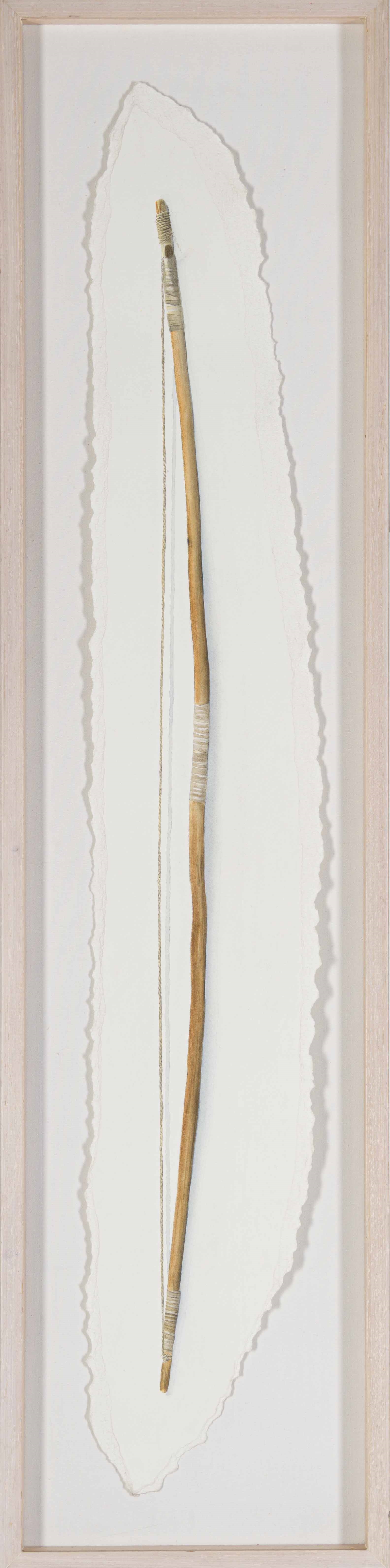 A minimalist composition featuring a single bow against a plain background.