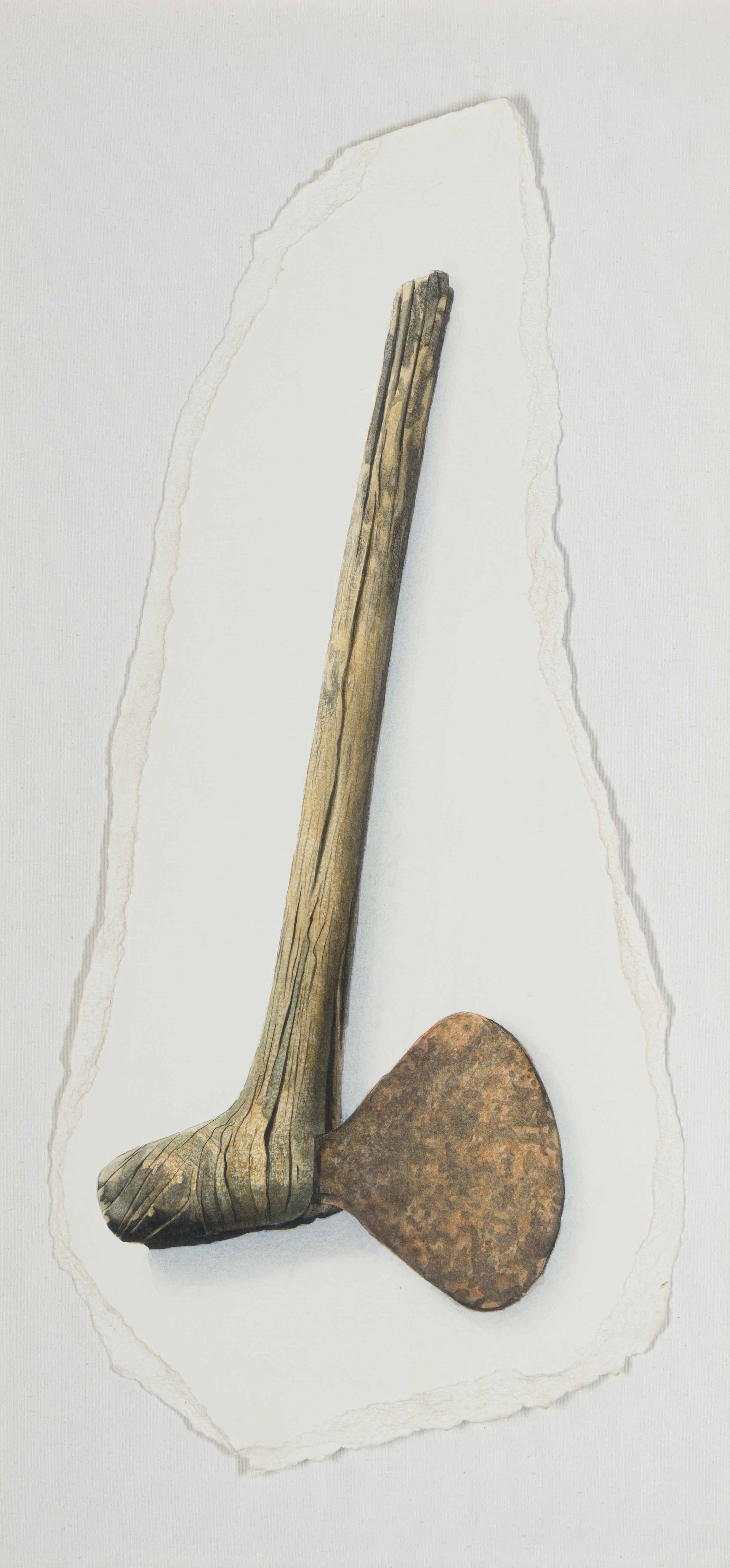 A rustic wooden axe head mounted on a textured white background.